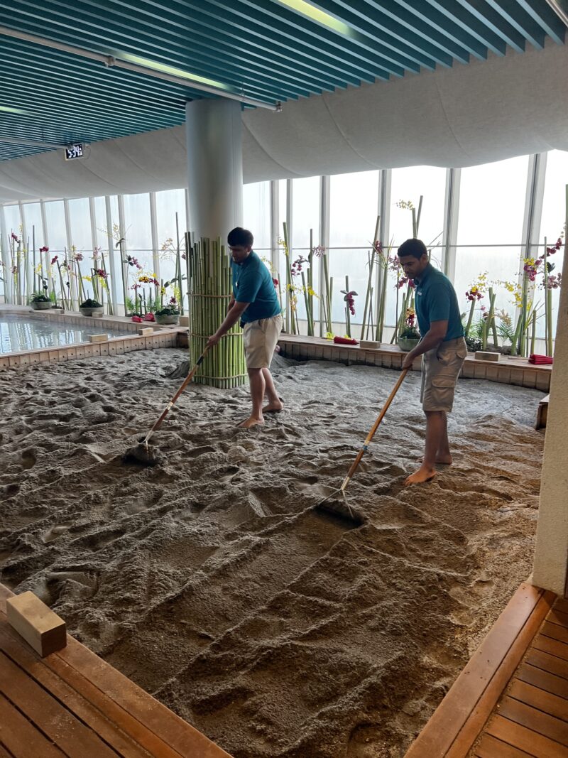 Volcanic Sand Bath - raking sand