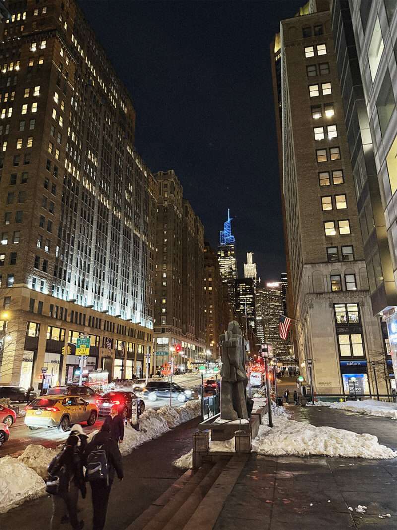 Midtown Manhattan skyline at night near Lexington Avenue in winter.